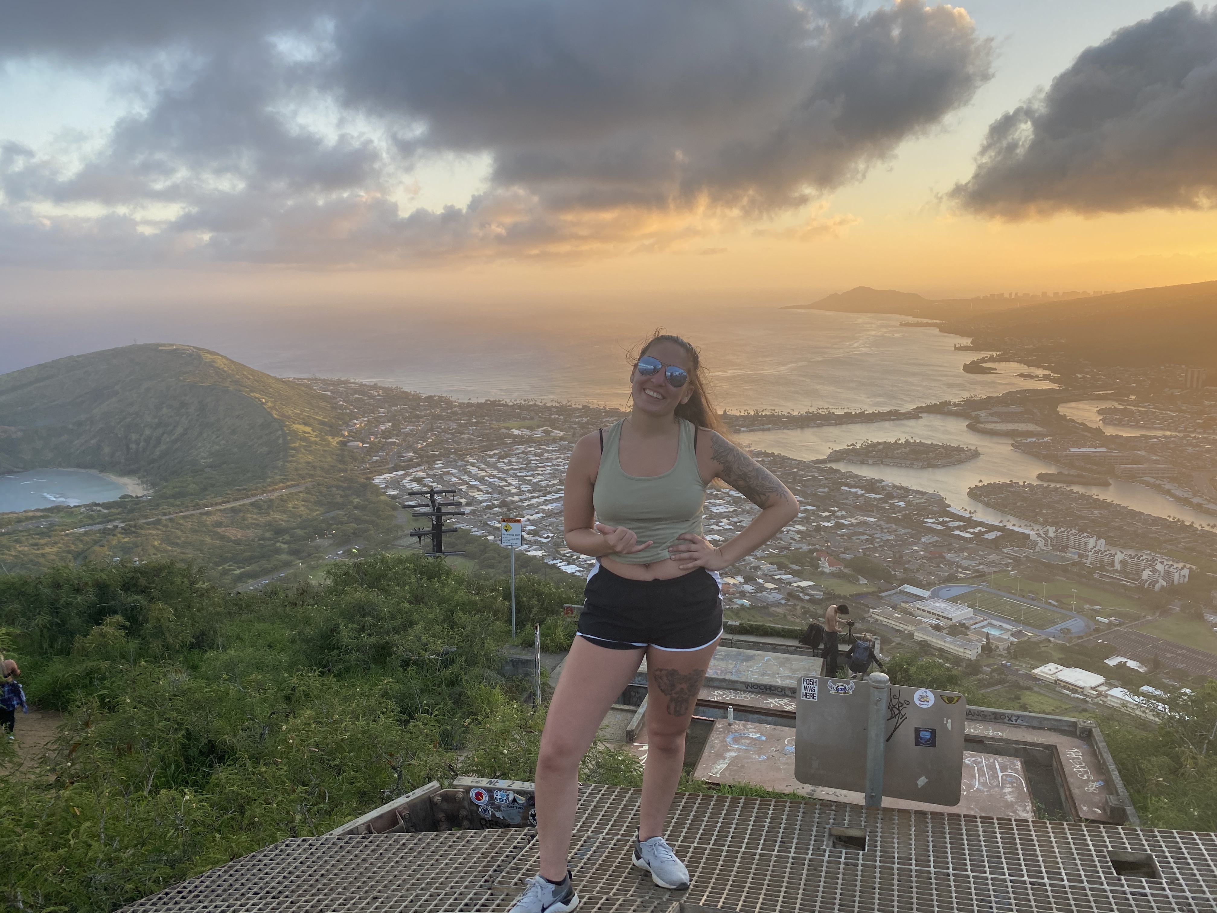 Golden sunrise viewed from a Hawaii mountain summit above the clouds
